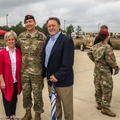 Randy and Debbie Wise posing for photos with a soldier