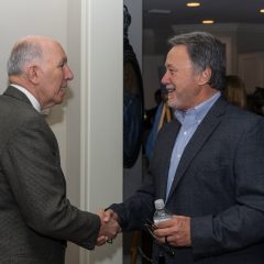Randy Wise shaking hands with a man at the event