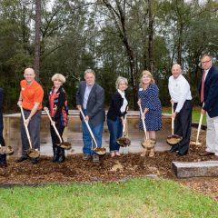 Randy and Debbie with a another group of people breaking ground at the home site