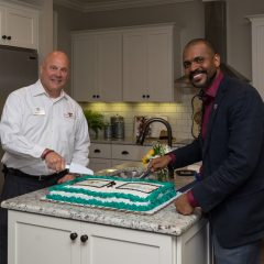 Brian Haugen and Johnny Moses cutting the cake