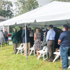 Audience at the 2019 Community Spirit Home Event standing to attention